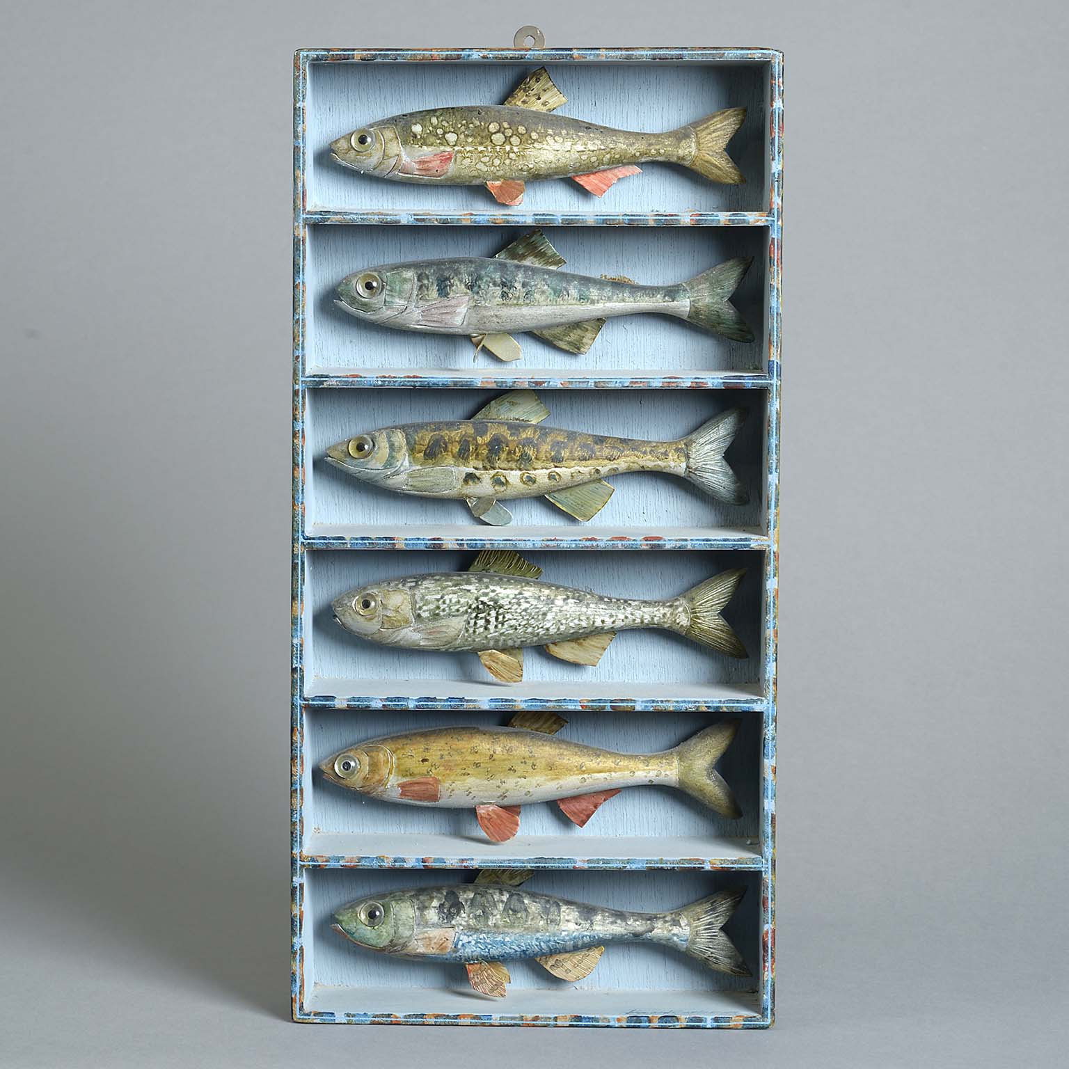 Six carved Wood and Polychrome Painted Fish by Howard Carter